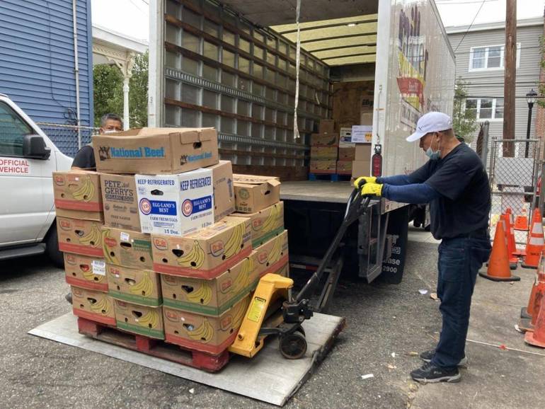 Man Loading Food Into Truck