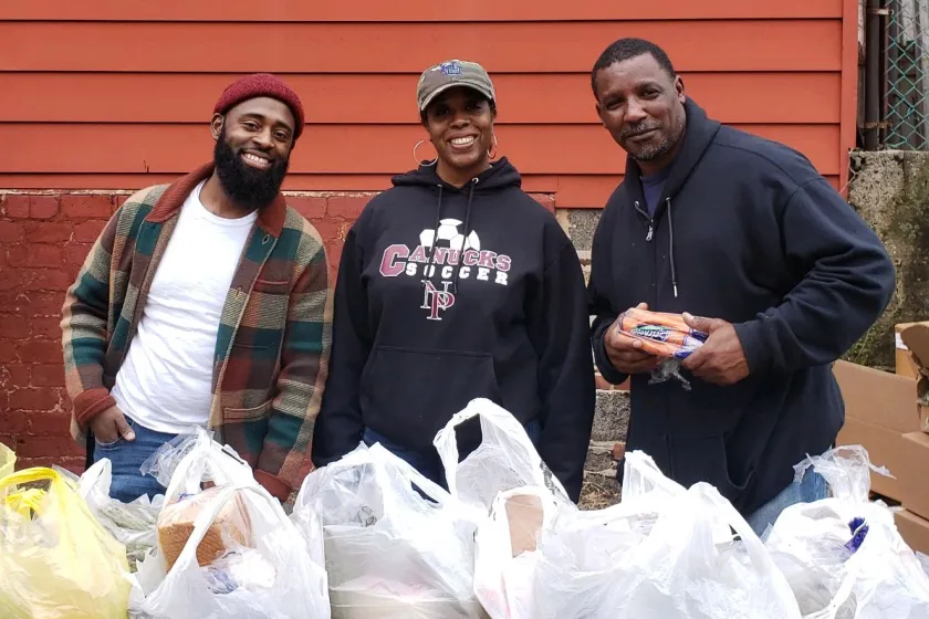 Newark school workers have managed to keep a weekly vegetable distribution going even during the pandemic. From left: Marquise Singleton, the parent liaison at Hawthorne Avenue School; Erica Walker, an early childhood social worker; and Dwayne Tatum, parent liaison at George Washington Carver School.