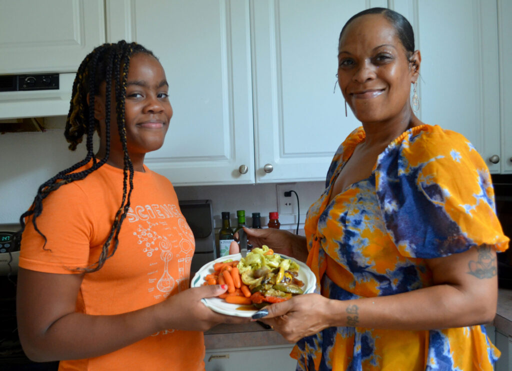 Serena and Skye use food donated by Table to Table to create a healthy meal