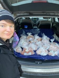 Kaleb Lohmann with a trunk load of rescued food using Table to Table's I-Rescue App