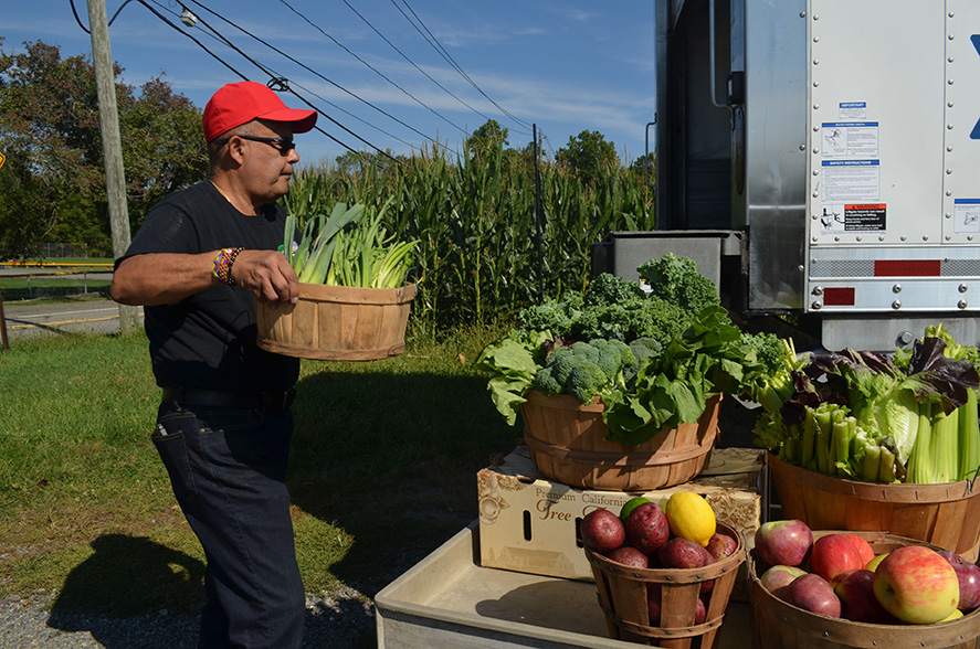 Driver Edgar Brieva rescuing fresh produce from a farm for Table to Table.